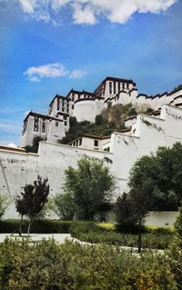 Low angle view of castle against cloudy sky