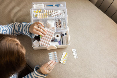 High angle view of girl playing with toys on table