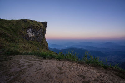 Scenic view of mountains against clear sky during sunset
