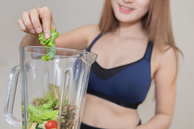 Midsection of woman holding food
