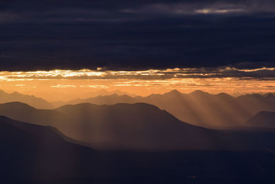 Scenic view of mountains against sky during sunset