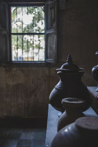 Close-up of vase on table against window