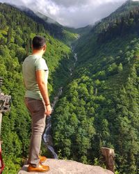 Full length of man standing on mountain