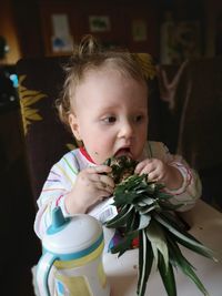 Portrait of cute baby girl at home