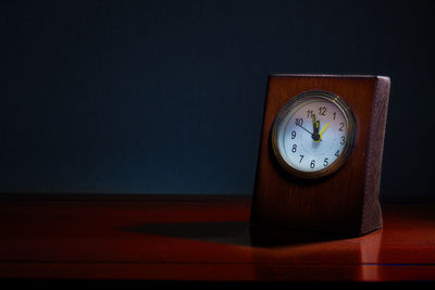 Close-up of clock on table