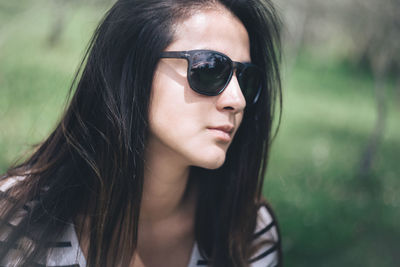 Close-up of young woman wearing sunglasses