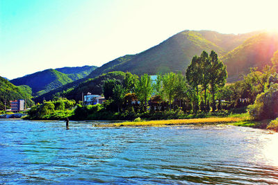 View of calm lake against mountain range