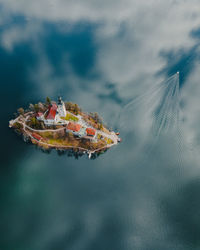 Aerial view of boats in sea against sky