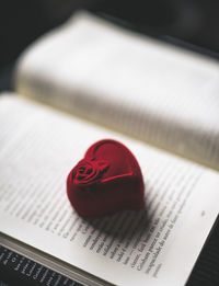 Close-up of heart shape on book