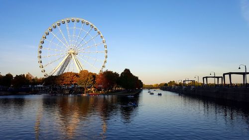 Ferris wheel at riverbank