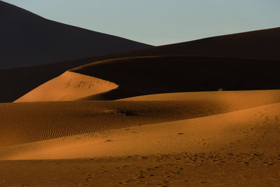 Scenic view of desert against clear sky