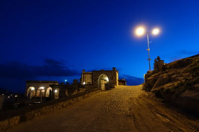 View of illuminated buildings against sky at night