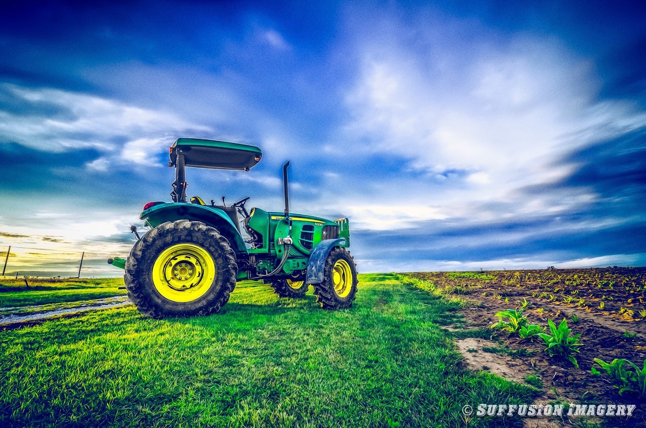 sky, transportation, field, cloud - sky, land vehicle, mode of transport, landscape, grass, cloud, rural scene, agriculture, blue, plant, cloudy, nature, road, outdoors, bicycle, day, travel