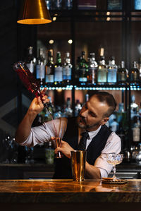 Midsection of man having food in restaurant