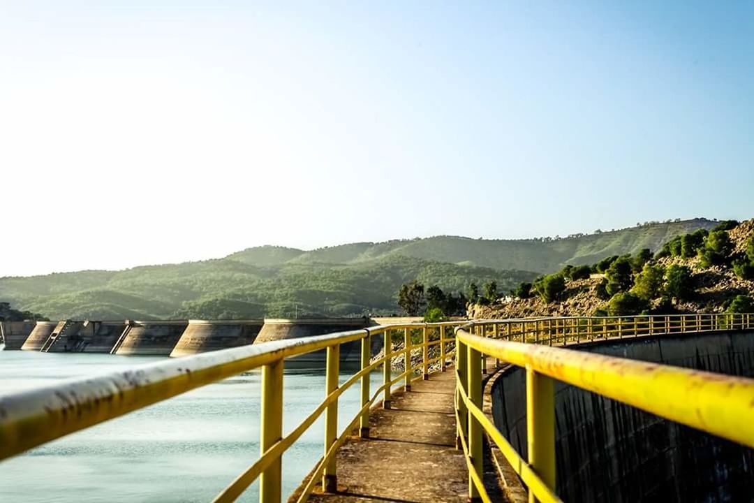 railing, footbridge, nature, mountain, outdoors, landscape, tranquility, clear sky, bridge - man made structure, wheelchair access, scenics, tranquil scene, no people, vacations, social issues, beauty in nature, day, sky, wave, eco tourism, elevated walkway