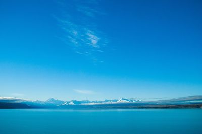 Scenic view of lake against blue sky