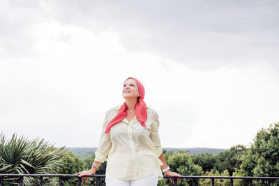 Senior woman with pink headscarf