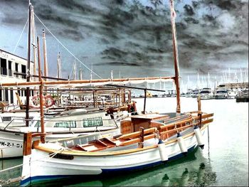 Boats moored at harbor