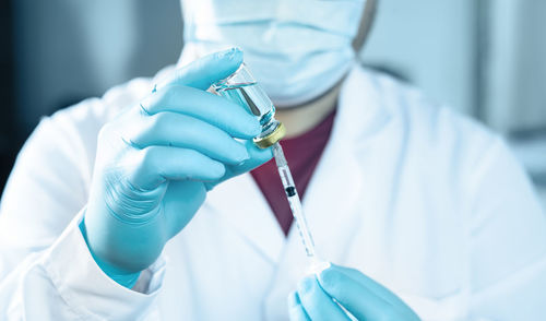 Close-up of human hand holding umbrella