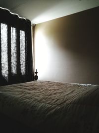 Sunlight falling on bed at home