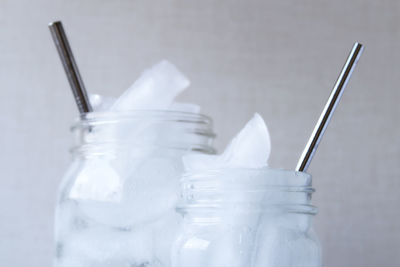 Close-up of ice in glass jar on table