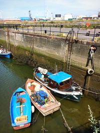 High angle view of fishing boats moored at harbor