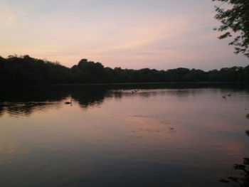 Scenic view of lake at sunset