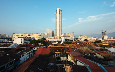 Buildings in city against sky