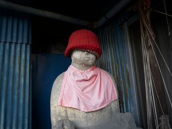 Rear view of man standing against wall