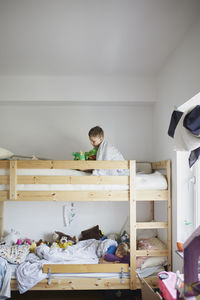 Brothers lying in bunk bed