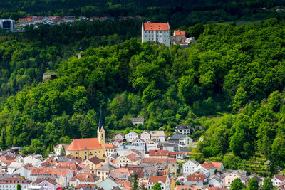 High angle view of townscape and trees in town