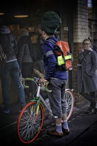 People riding bicycle on street