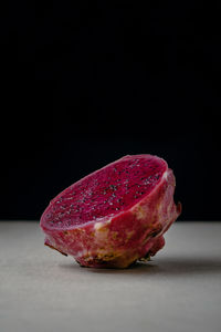 Close-up of apple against black background