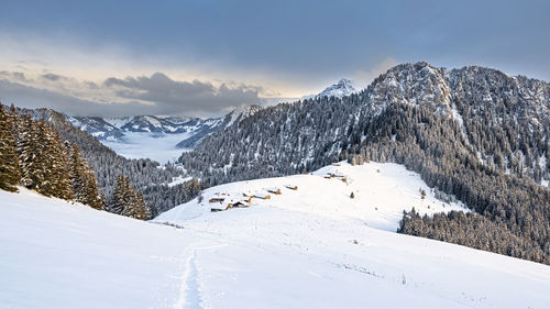 Snow covered mountain against sky