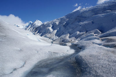 Scenic view of mountains against sky during winter