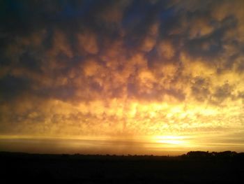 Scenic view of landscape at sunset