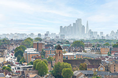 Buildings in city against sky