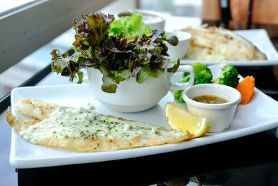 Close-up of food served on table