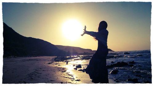 Scenic view of sea at sunset