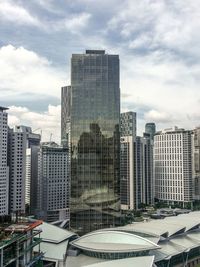 Modern buildings in city against sky