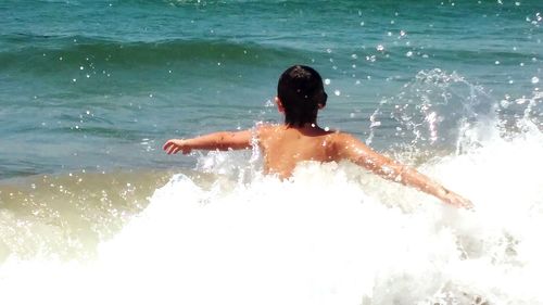 Boy playing in water