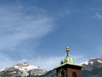 Low angle view of statue against blue sky