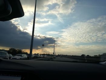 Cars on street seen through car windshield