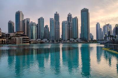 Buildings in city at dusk