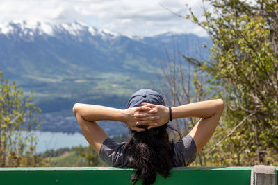 Portrait of woman sitting on mountain