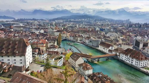 High angle view of river amidst buildings in city