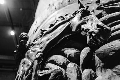 Low angle view of illuminated statue at night