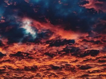 Low angle view of dramatic sky during sunset