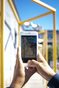 Man photographing with mobile phone