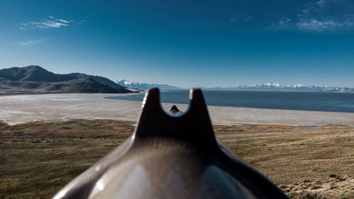 Close-up of a telescope at beach